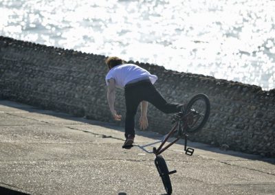Young lad going over his bike handlebars