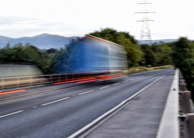 Fast moving lorry taken at slow shutter speed on bridge